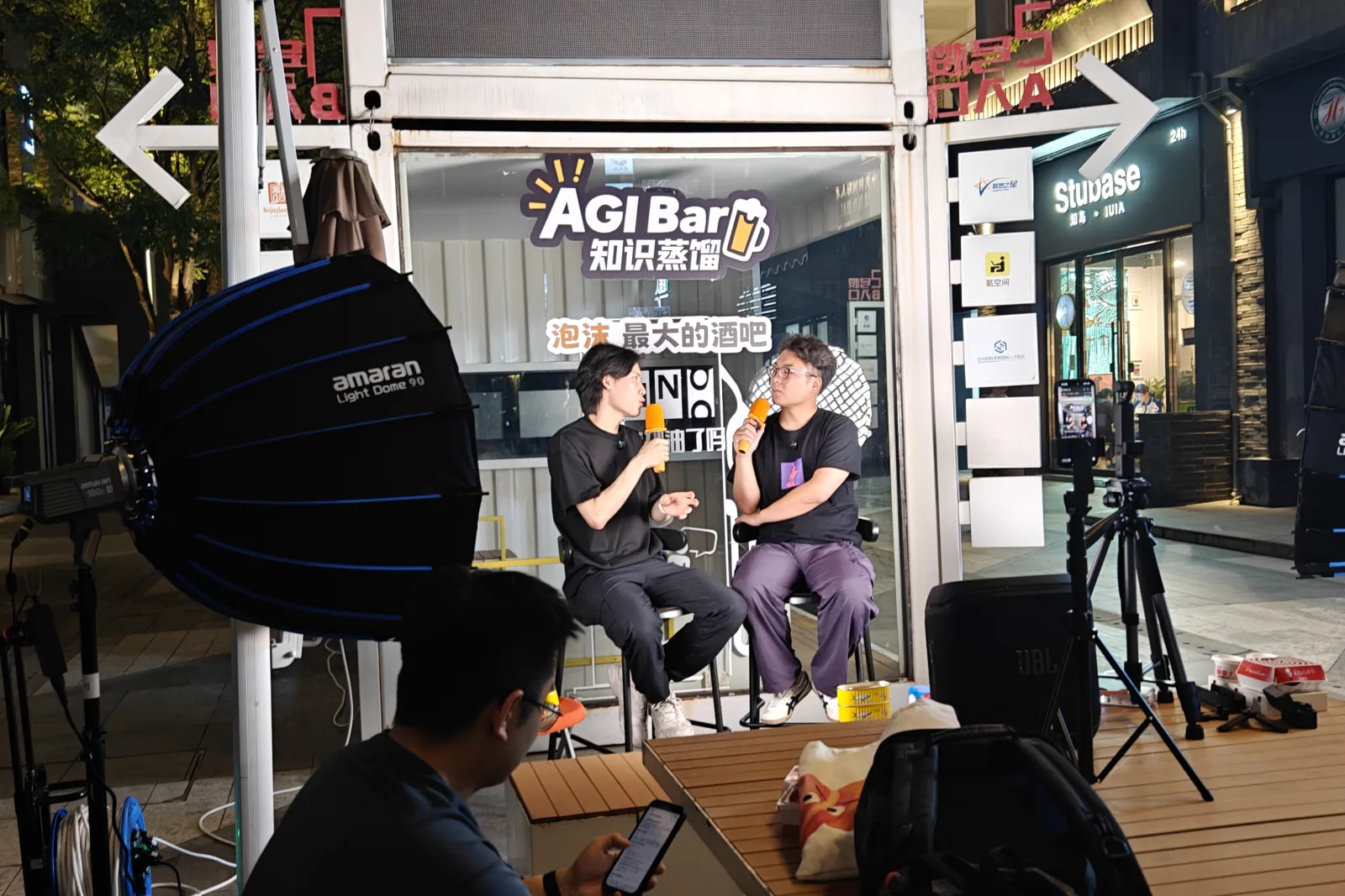 A live conversation outside AGI Bar